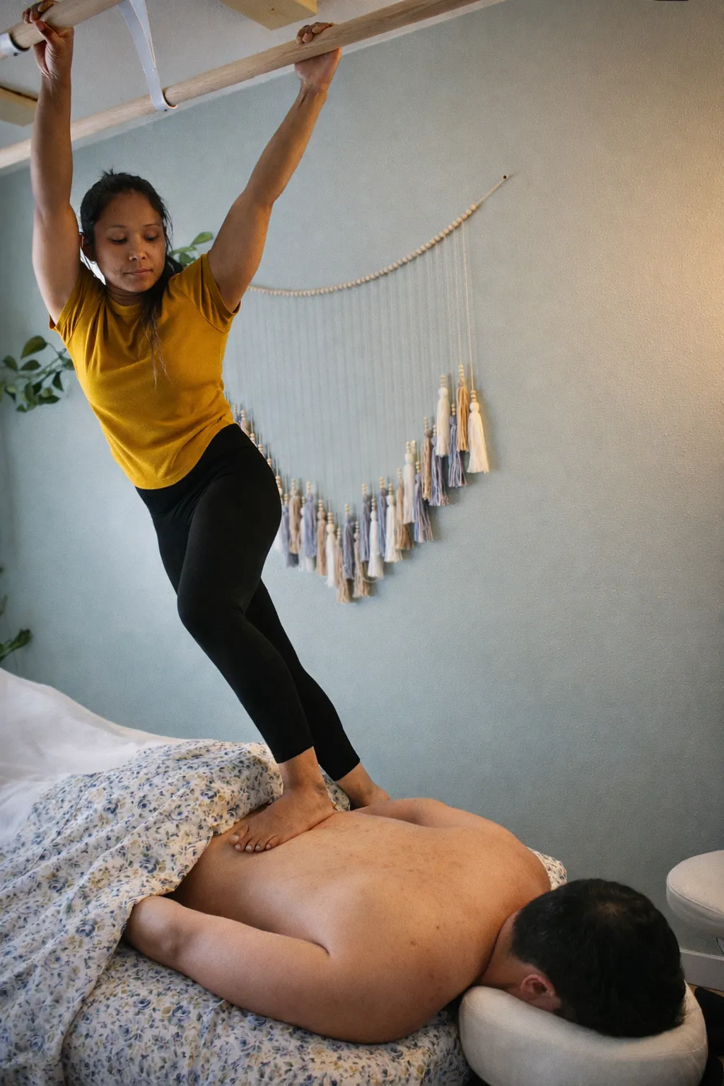 Ashiatsu barefoot massage room with overhead bars and massage table in Sandy Oregon wellness studio